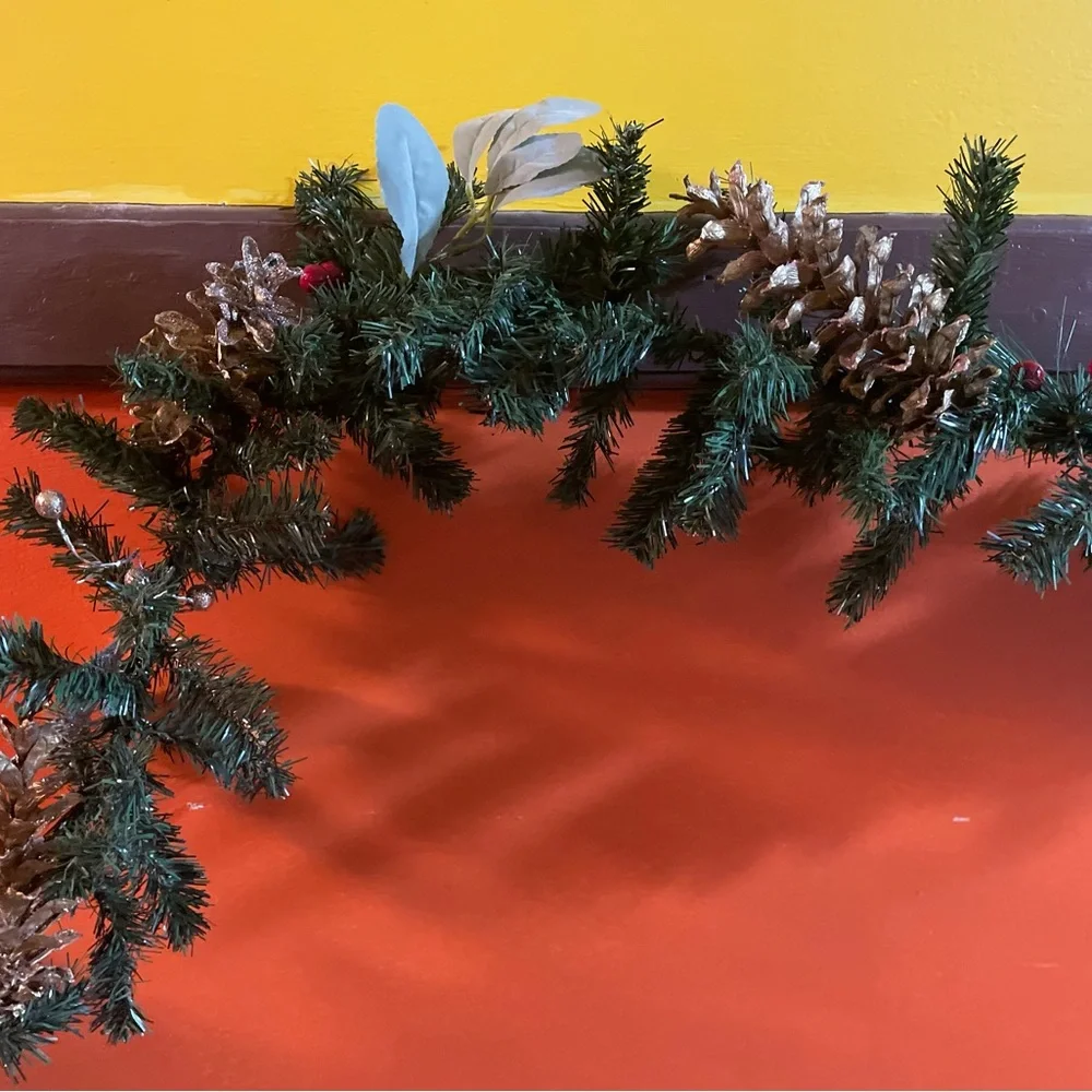 9 foot gold and silver faux evergreen garland, pine cones, berries